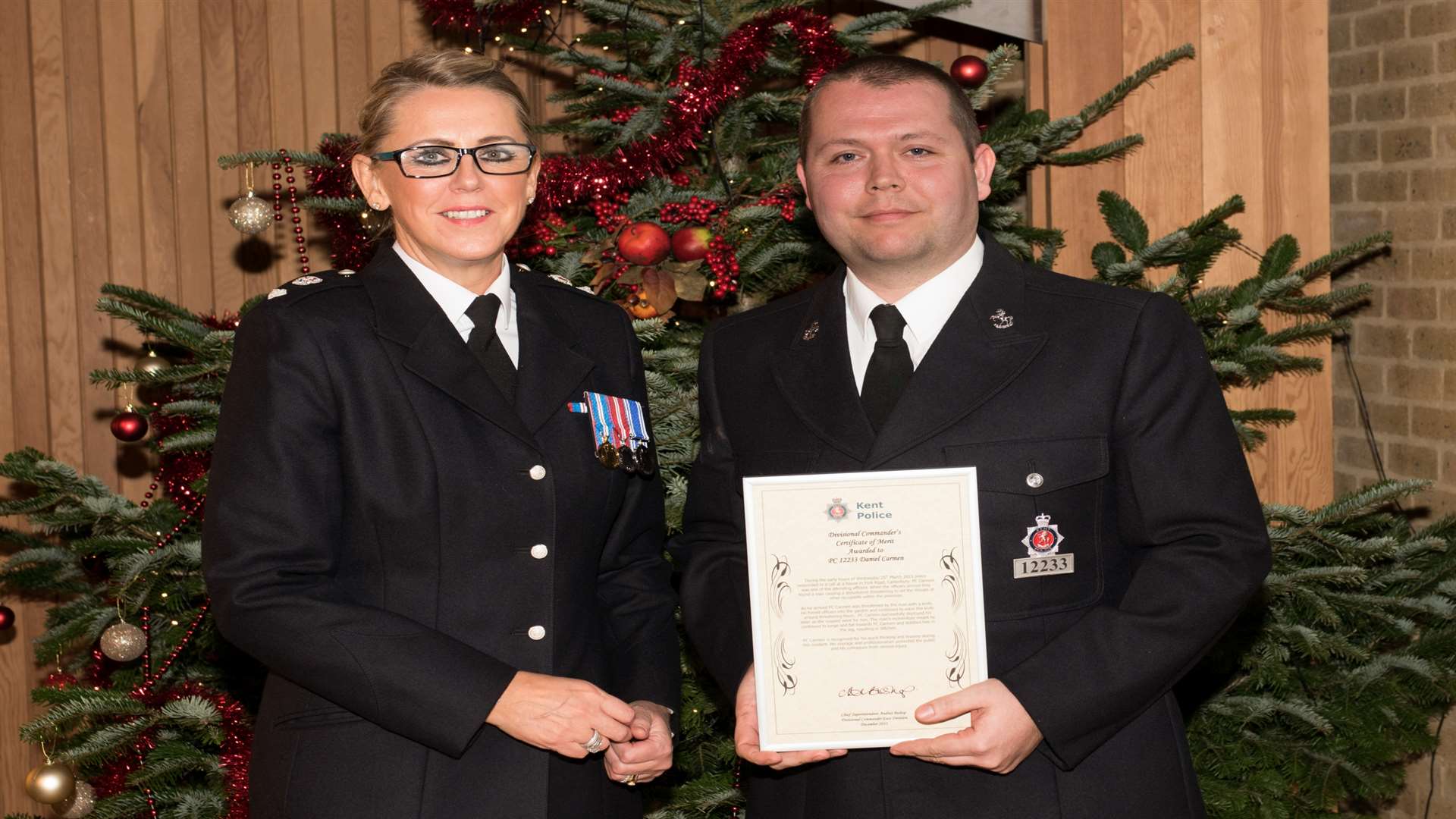 PC Daniel Carmen was one of a number of officers who were awarded for their tireless work across the district, after he was attacked by a man with a knife and needed eight stitches in his leg. Pictured with chief superintendent Andrea Bishop.