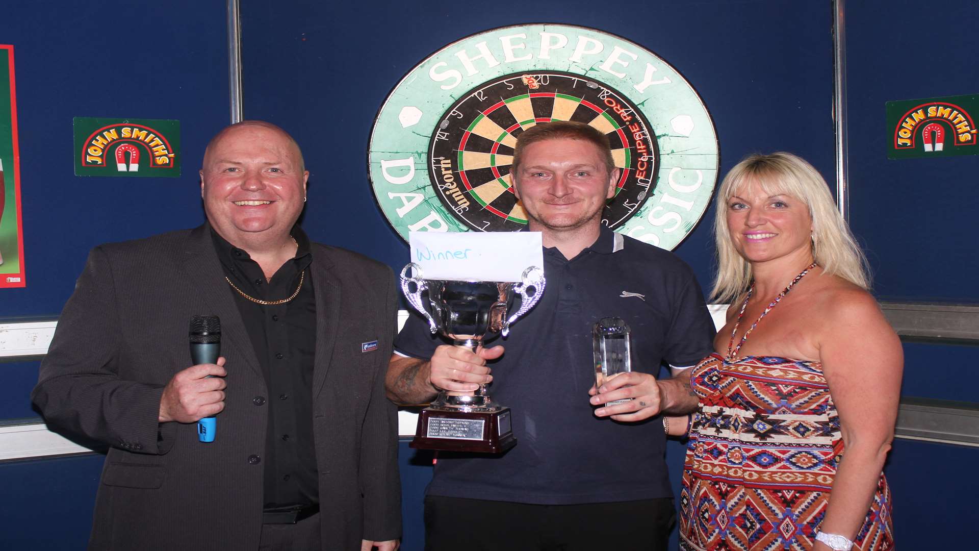 Maidstone's Barry Knight (centre) beat Paul McDine in the 2014 Sheppey Darts Classic final