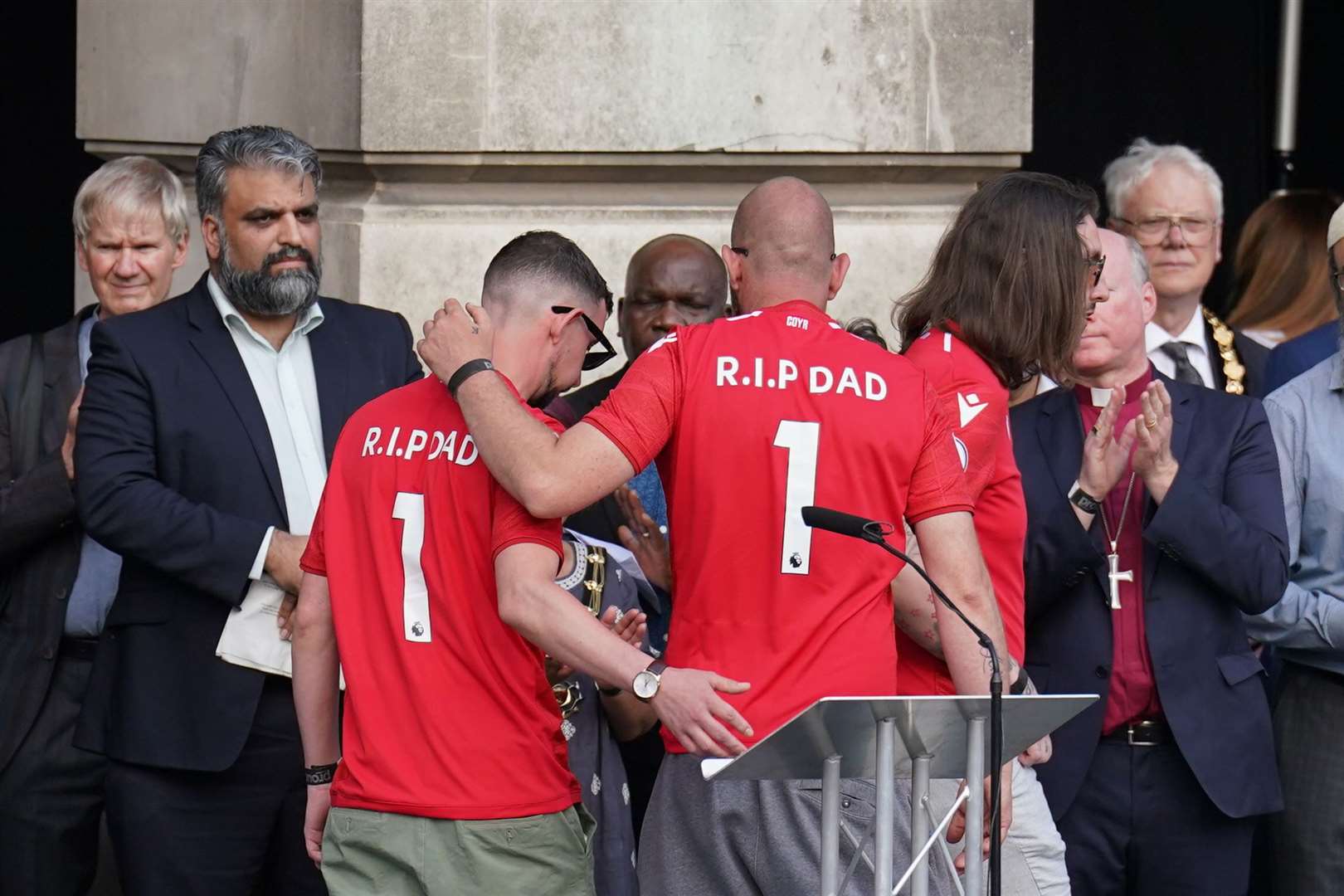 Ian Coates’ sons during a vigil in Old Market Square, Nottingham, on Thursday (Tim Goode/PA)