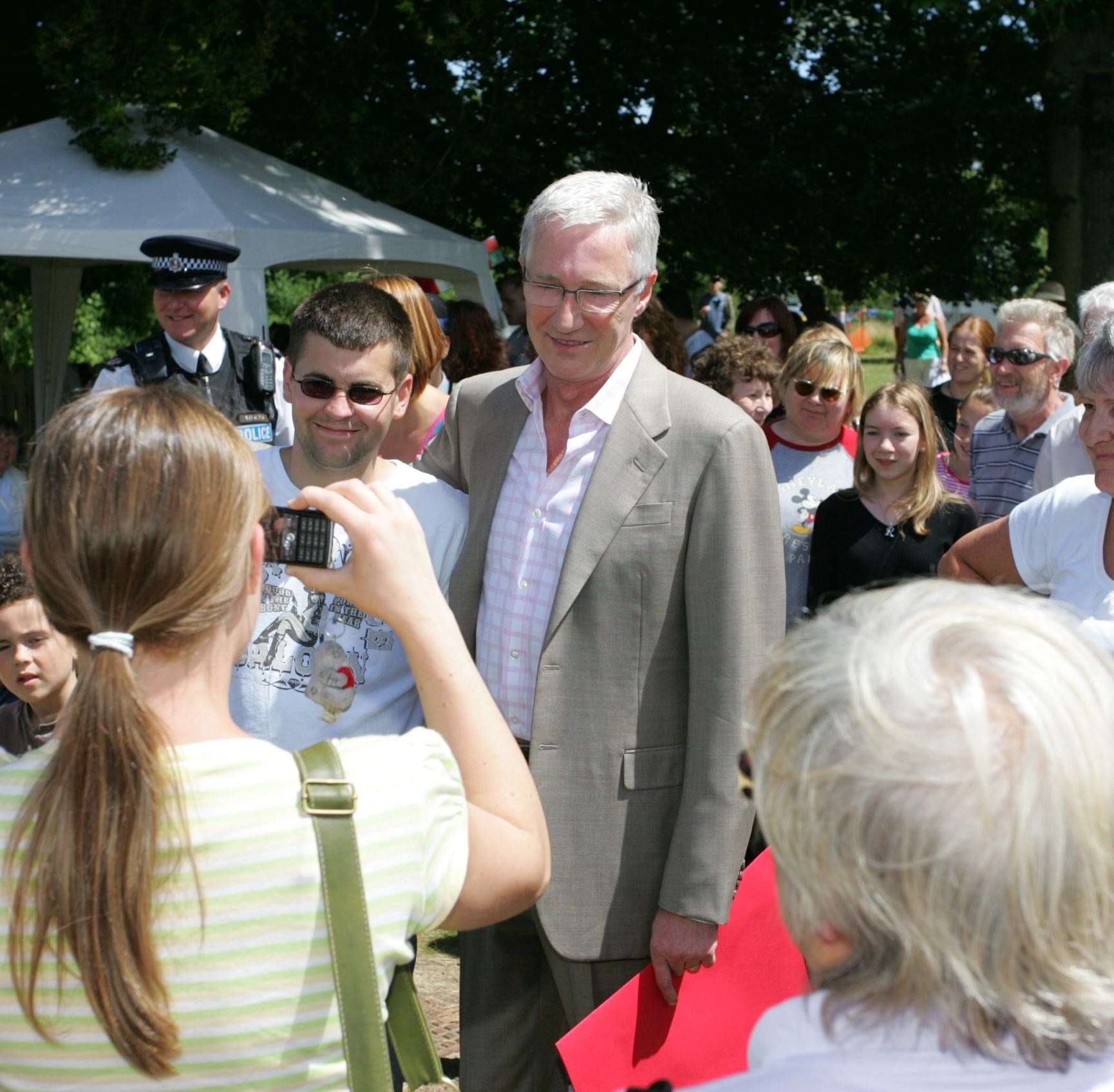 Paul O'Grady having his picture taken with fans in 2008 at Aldington Primary School Summer Fete. Picture: Martin Apps