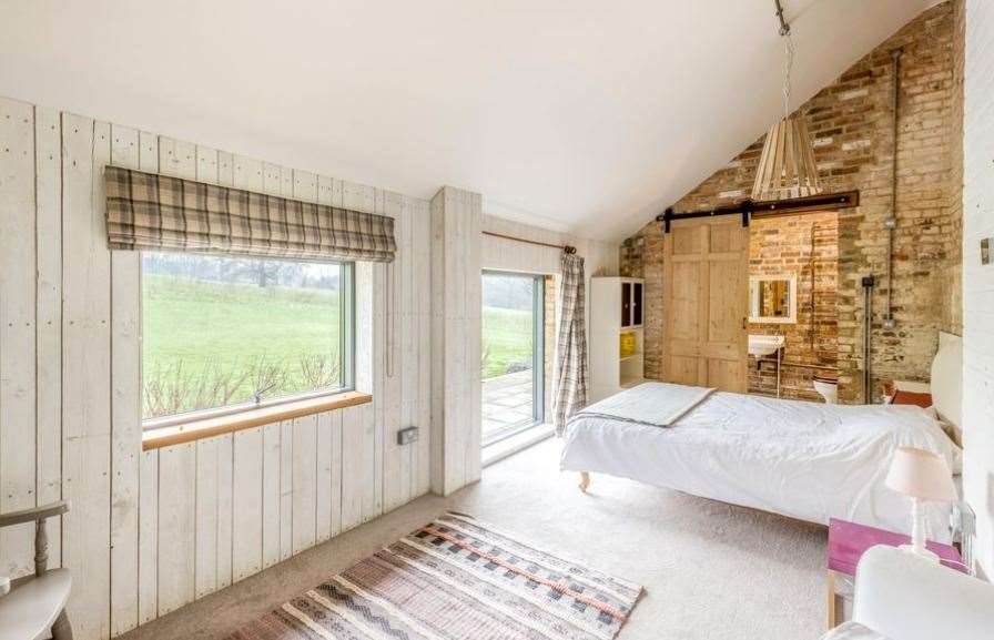 The house boasts three bedrooms with views of the gardens and countryside. Picture: Knight Frank