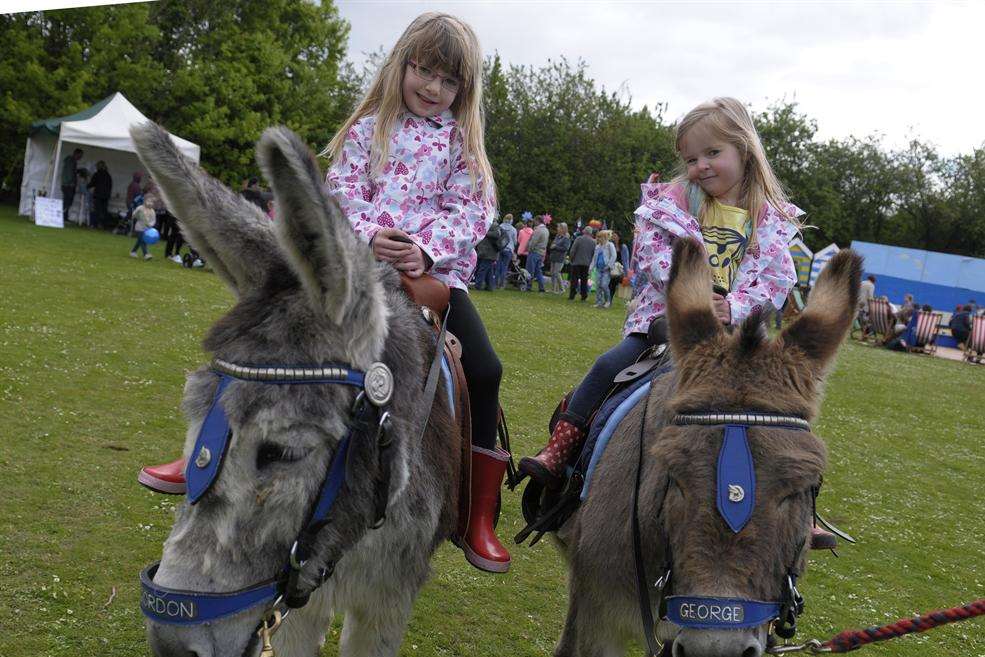 Poppy, 6, and Amelia, 3, enjoy a donkey ride