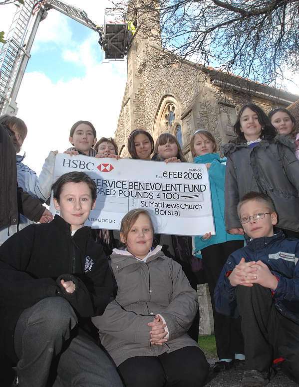 Children at St Matthew's Church, Borstal , with the cheque they presented to the fire service benevolent fund. Picture: BARRY CRAYFORD