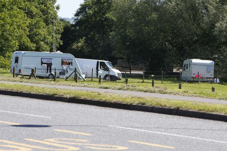 Caravans are parked near the donkey field.