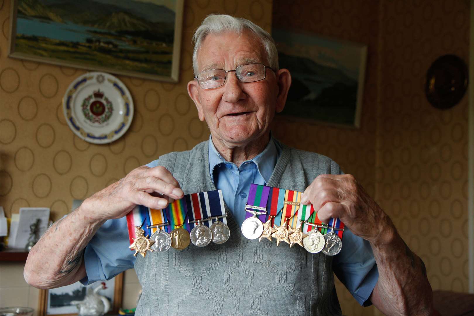 Happier times: When Leslie Stelfox was reunited with his war medals, which were recovered by police five years ago