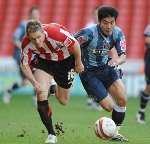 Zheng Zhi takes on Sheffield United's Matthew Kilgallon. Picture: BARRY GOODWIN