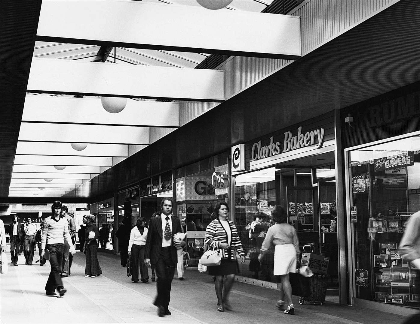 1975 - Flares, bell-bottomed trousers and kipper ties were the trend in this picture of the Tufton Centre. Picture: Steve Salter