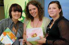 Sasha Cross, Samantha Read and Claire Pasterfield admire a baby's foot casting from Impala Impressions