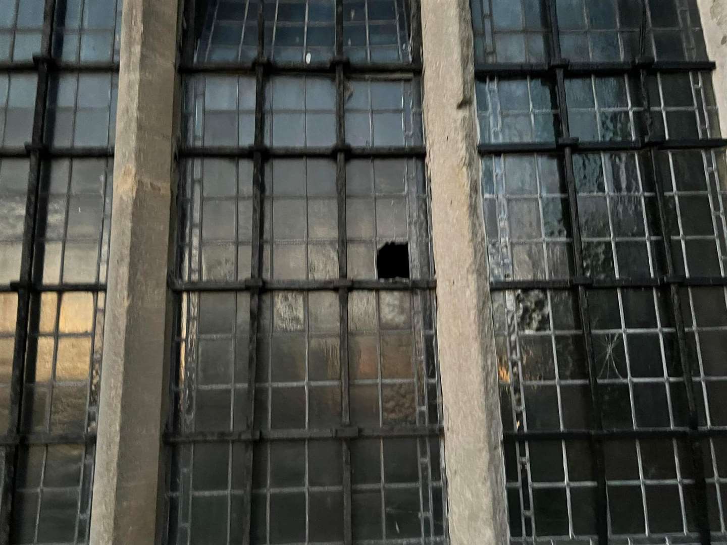 The damaged windows at the Cliffe church