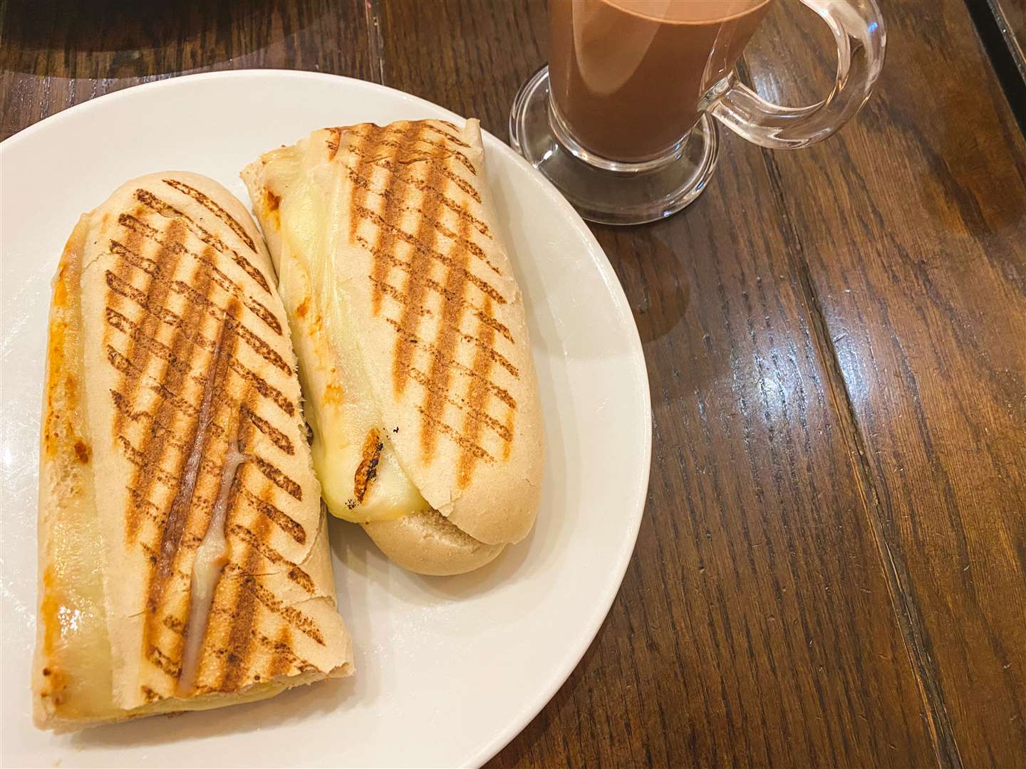 Mozzarella and red pesto panini alongside the toasted marshmallow hot chocolate