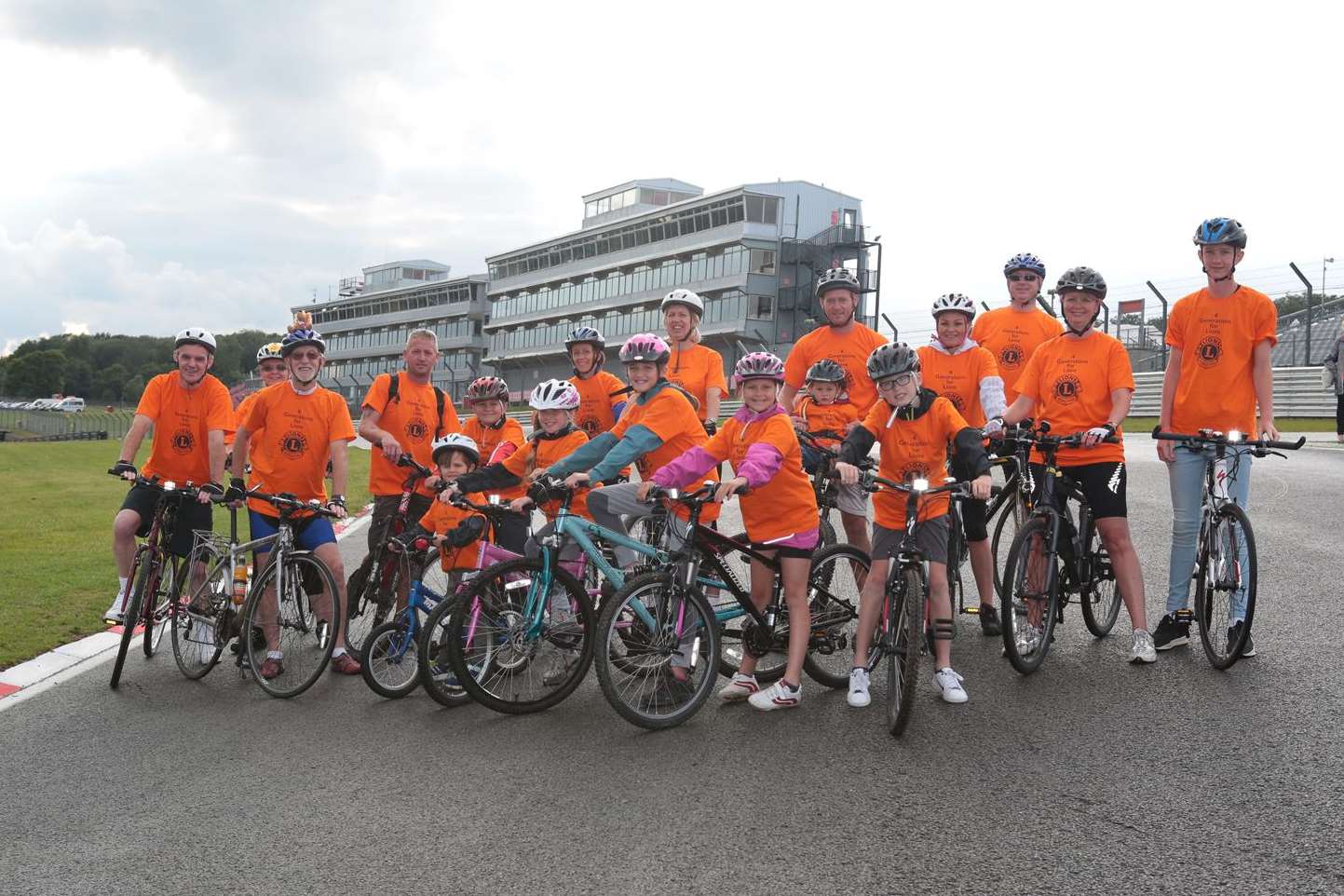 Bob Kneller, of Redhill Wood, celebrates his 80th birthday with four generations of his family riding around the race circuit to raise money for EllenorLions Hospices.