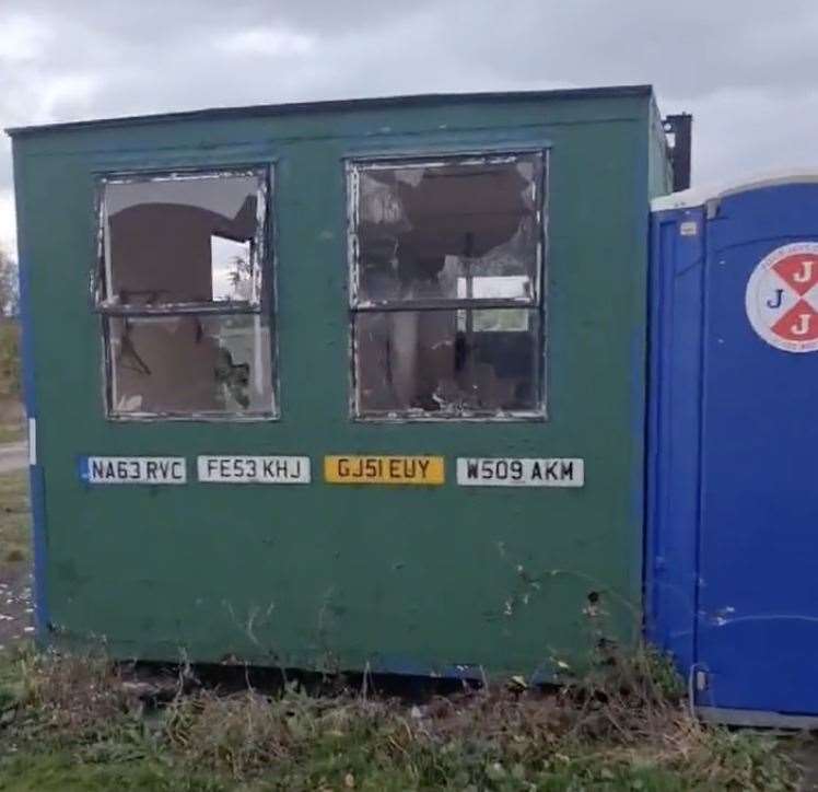 Windows of the portacabin were smashed by rocks on the ground. Picture: Paul Duval