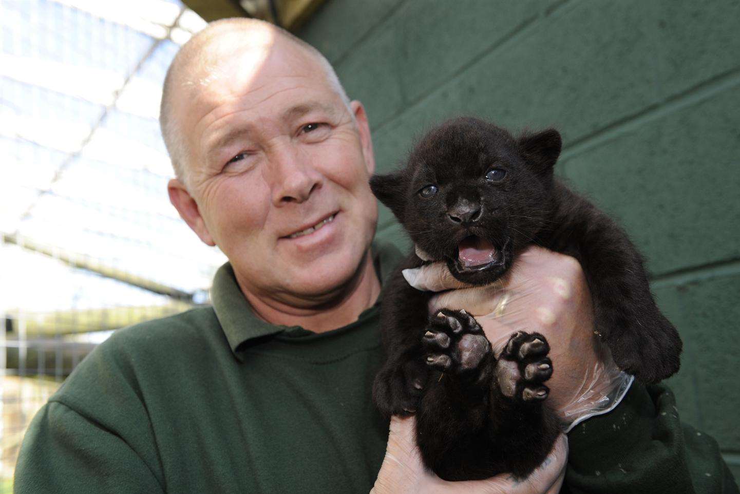 Wingham Wildlife Park owner Tony Binskin holds the cub