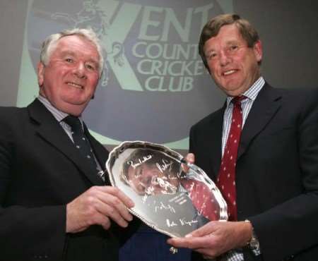 George Kennedy (left) presents Carl Openshaw with a silver salver engraved with the autographs of all nine club presidents during his term in office