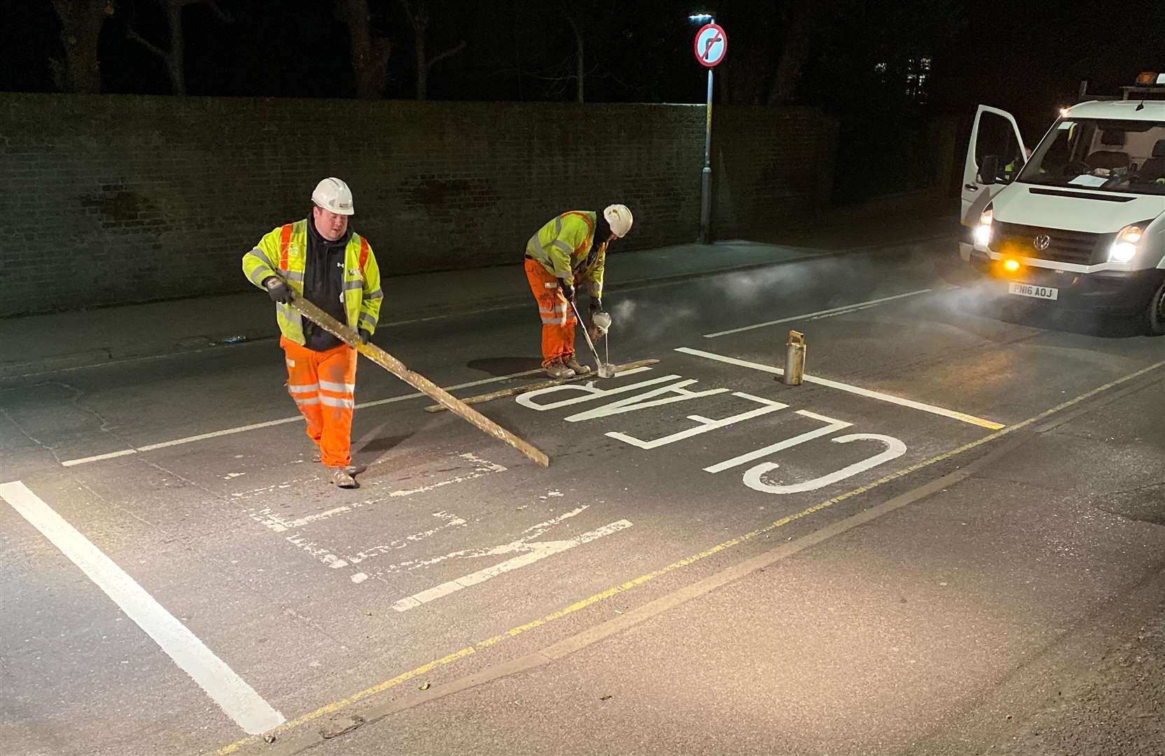 Simon Tyler took this picture of "brilliant" workmen updating the ‘Keep Clear’ lines outside his house