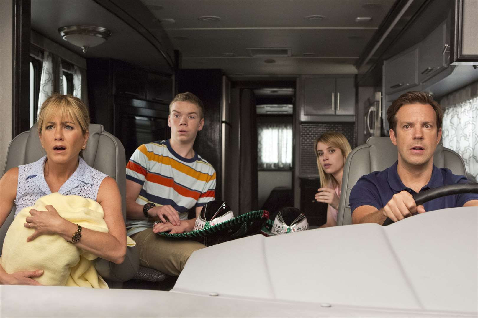 Will Poulter as Kenny, Emma Roberts as Casey, Jason Sudeikis as David and Jennifer Aniston as Rose in We're The Millers. Picture: PA Photo/Warner Brothers.