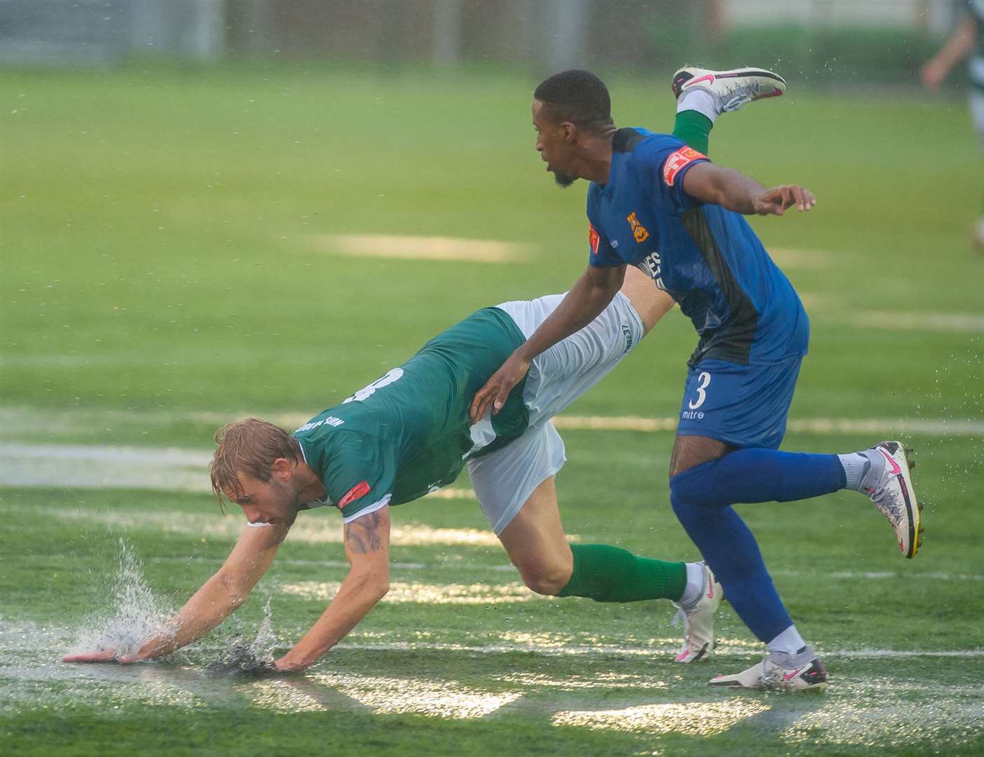 Tommie Fagg takes a tumble in the rain during Ashford's draw with Three Bridges Picture: Ian Scammell