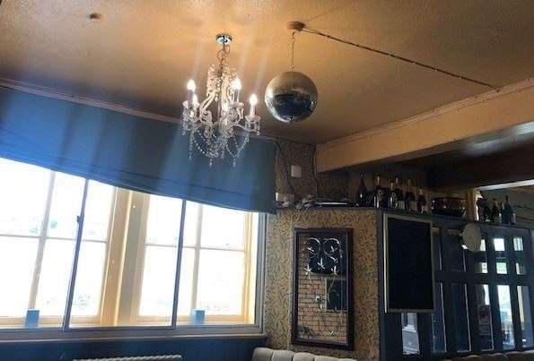 You might occasionally see a chandelier in a pub, or even a mirror ball but I’ve never seen the two in such close proximity