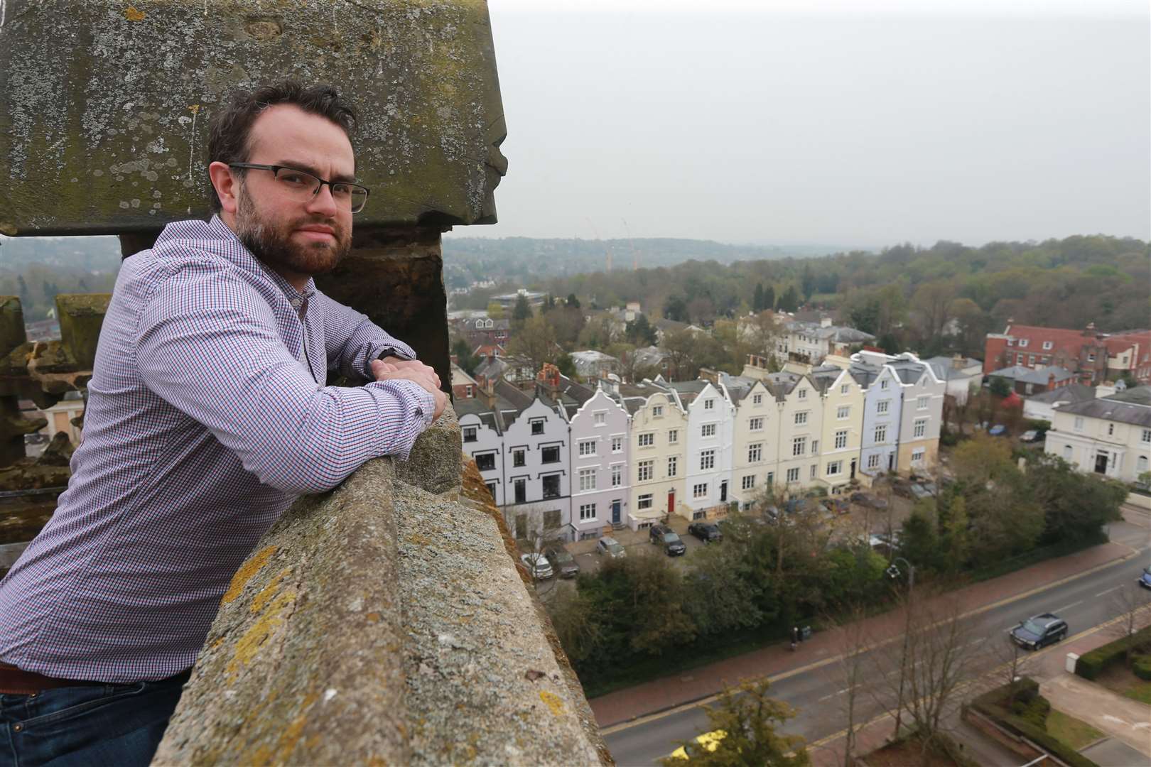 Alex Green, executive director of the Trinity Theatre stands at the top of the clock tower overlooking Tunbridge Wells