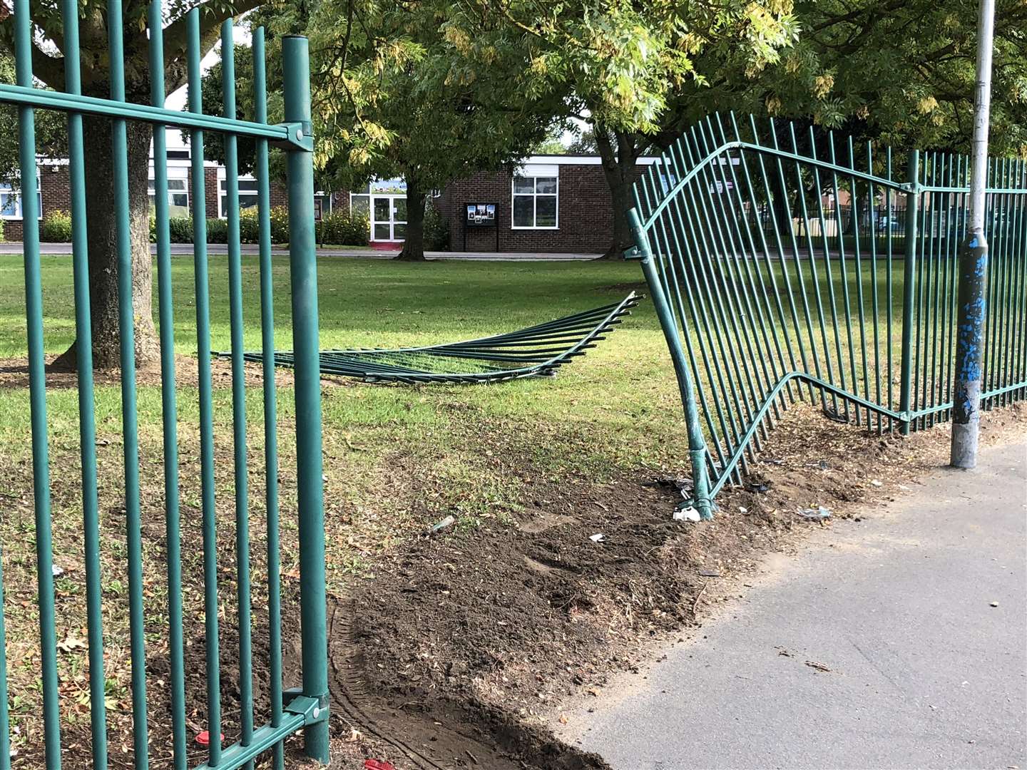 Warped and broken railings outside Brookfield Junior School