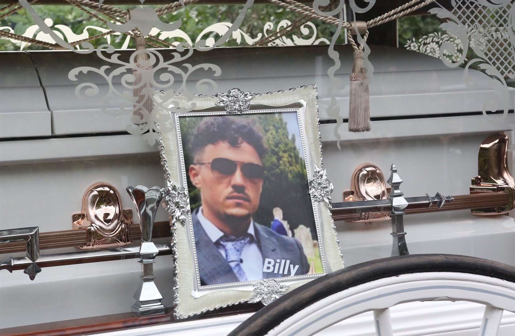 Billy's picture next to his coffin. Picture: UKnip