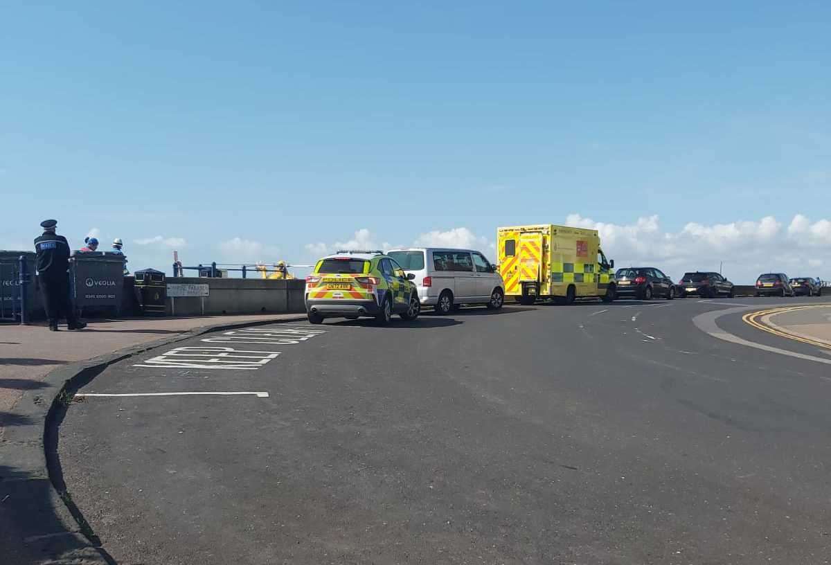 The emergency vehicles are at the scene along the seafront