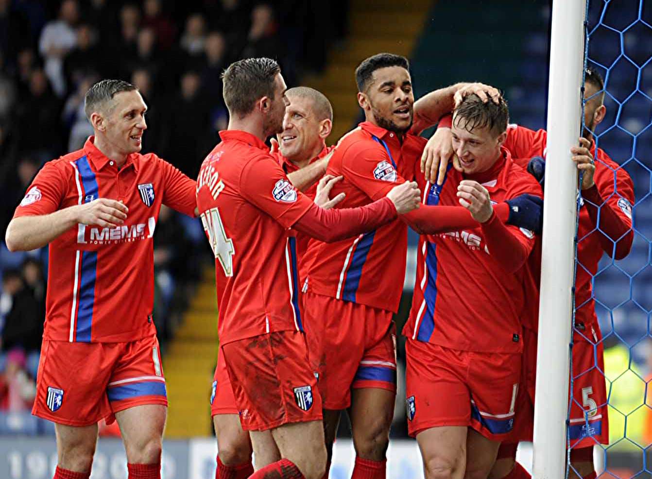 Gillingham celebrate their winning goal at Bury Picture: Barry Goodwin