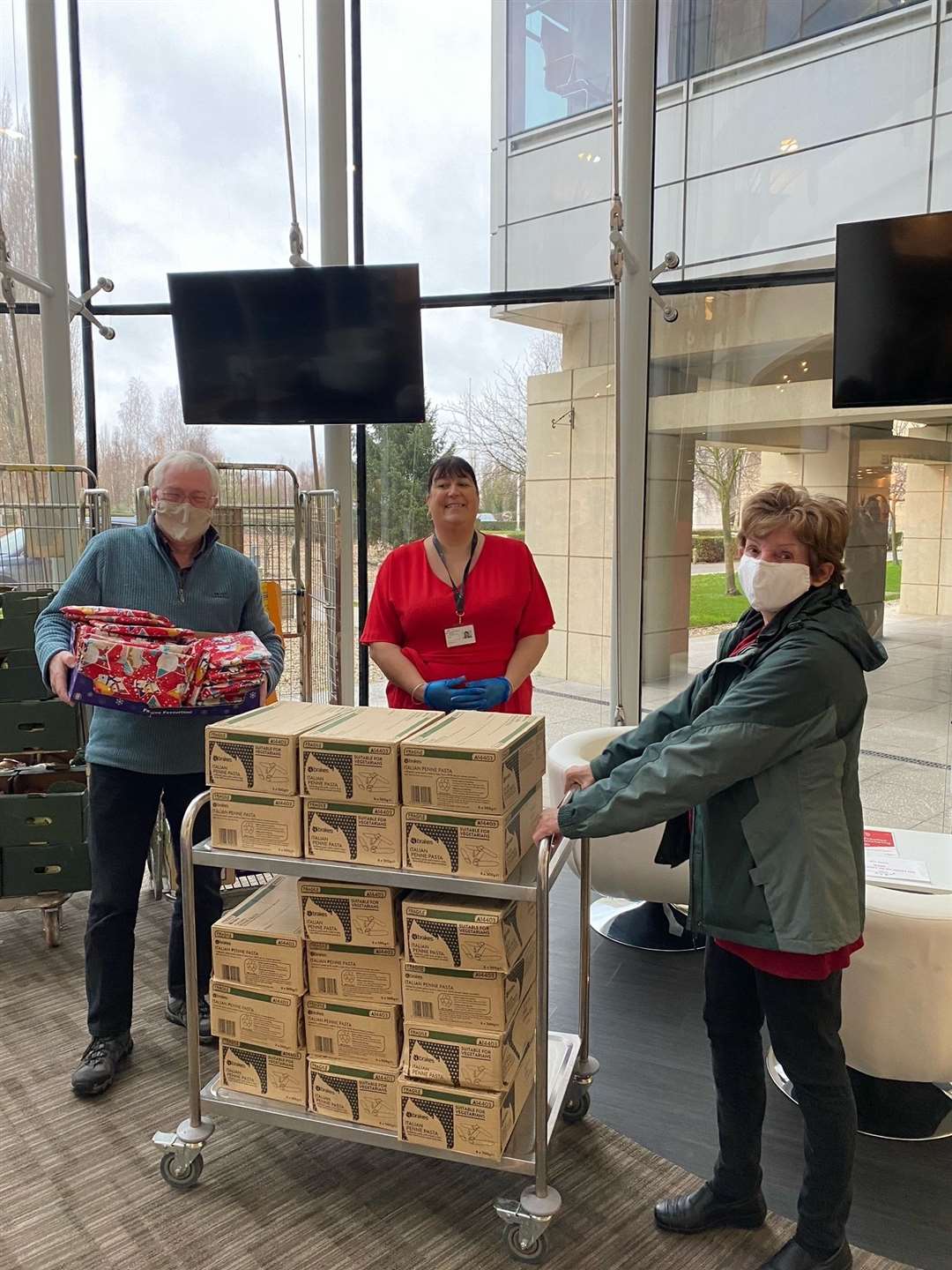 Tracey McKevitt – Catering Manager at Discovery Park with volunteers at Deal and Sandwich Food Bank and teh seasonal supplies paid for by workers at the park