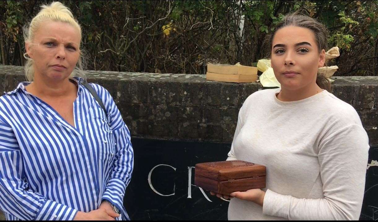 Tina and Lauren-Lucy Jenkins outside court, holding the ashes of father, Andrew