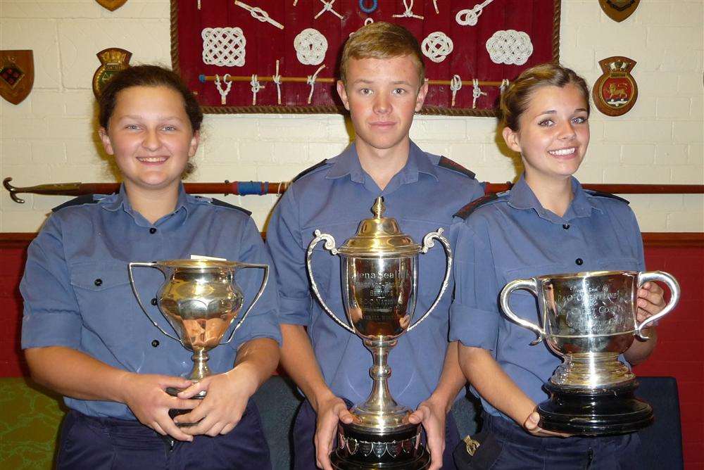 Cali Jeferies, Daniel Snook and Laura Snook proudly display honours won in a national regatta