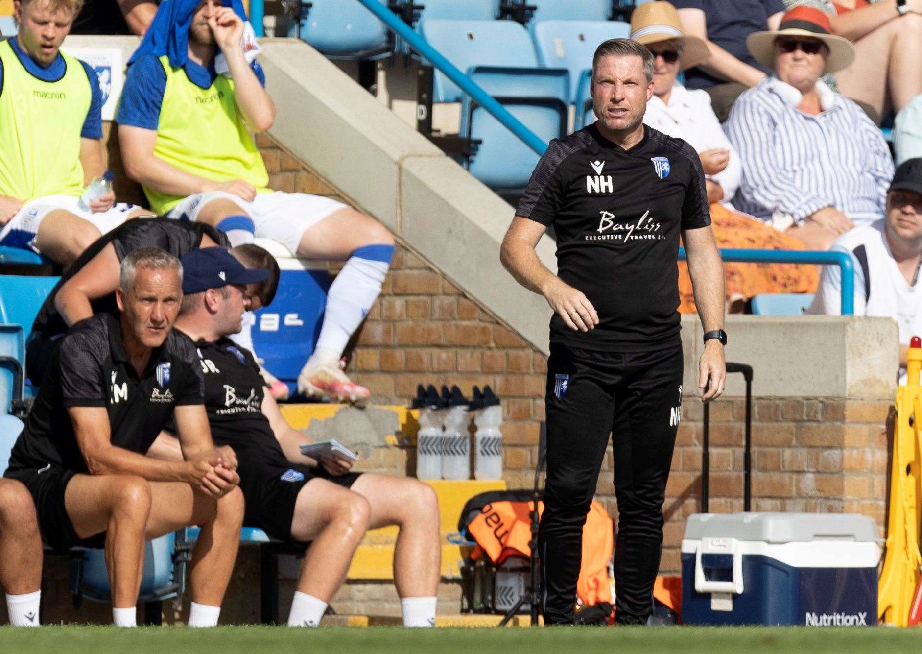 Gillingham manager Neil Harris on Saturday with Keith Millen in support, as no.2 David Livermore was in the stand serving the first of a four-match touchline ban Picture: @Julian_KPI