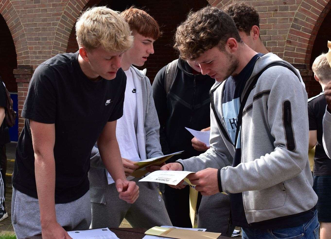 Borden Grammar pupils Tom Farley, Jamie Rees and Harrison Boyce-Huggins compare GCSE results at the Sittingbourne school