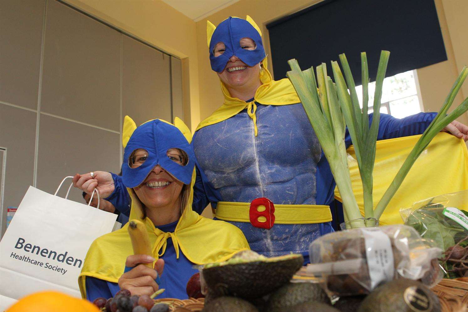 From left, Donna Avery and Emma Clements, dressed as bananaman are Support Service Coordinators at Benenden Hospital where they are promoting healthy eating