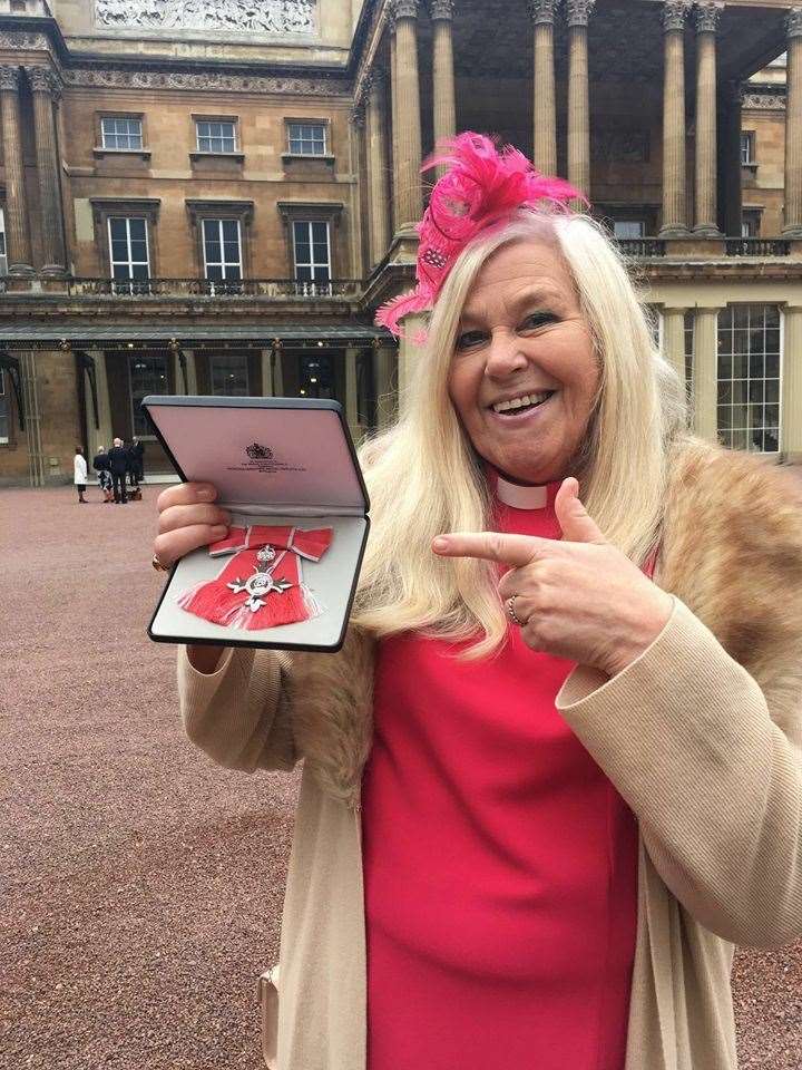 Cindy Kent with her MBE at Buckingham Palace