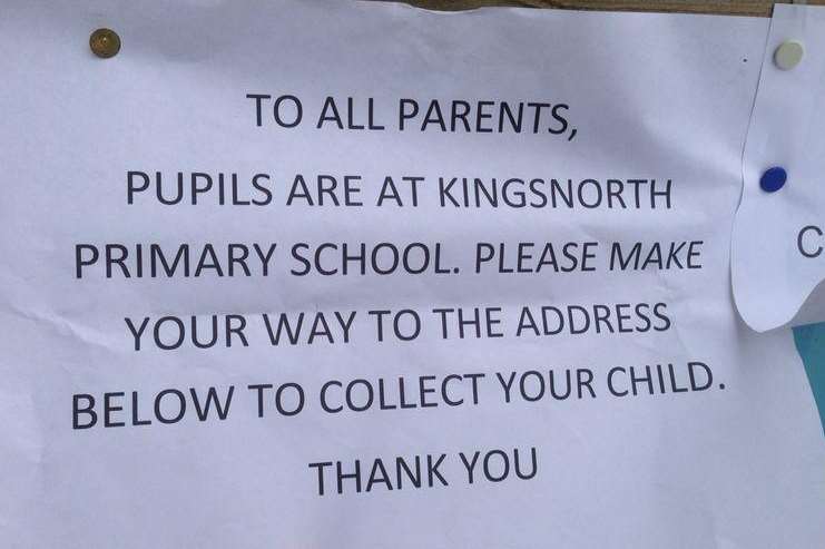 A sign left for parents on the gates of Furley Park Primary Academy