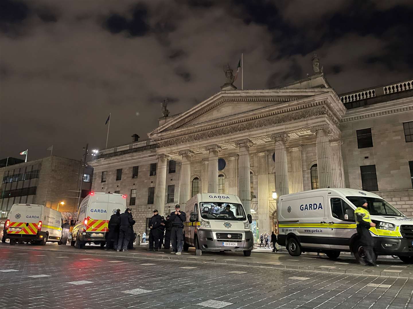 Garda outside the General Post Office on O’Connell Street in Dublin following violent scenes in the city centre on Thursday evening (David Young/PA)