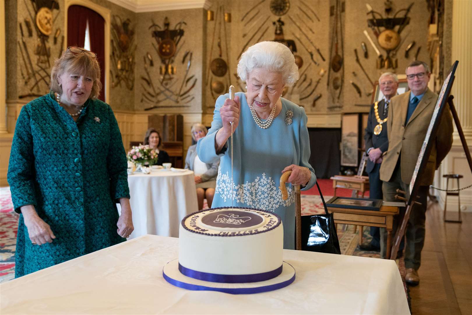 The Queen cutting a cake to celebrate the start of the Platinum Jubilee at Sandringham House (Joe Giddens/PA)