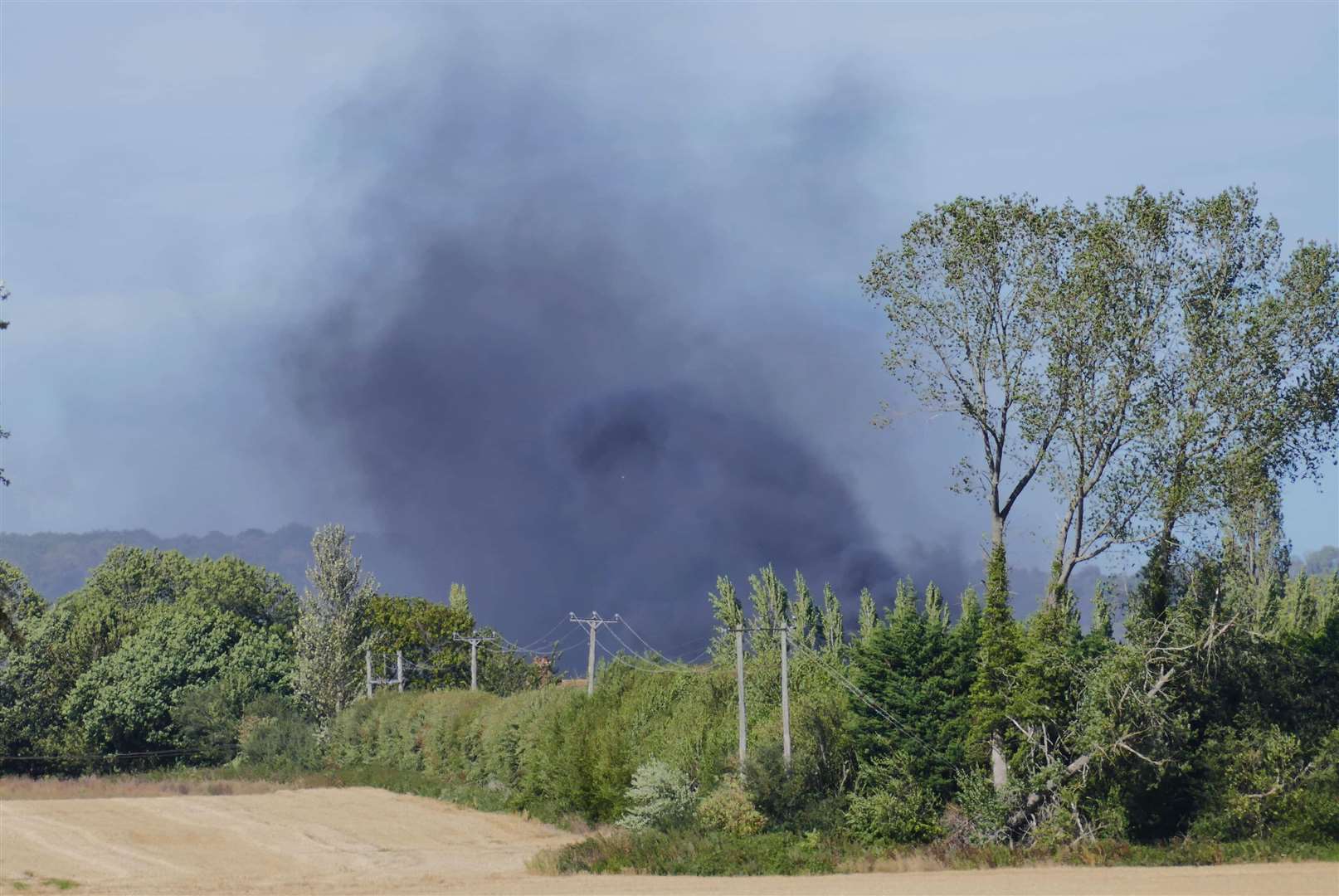 A large fire is currently ripping through a farm yard. Picture: Andy Clark