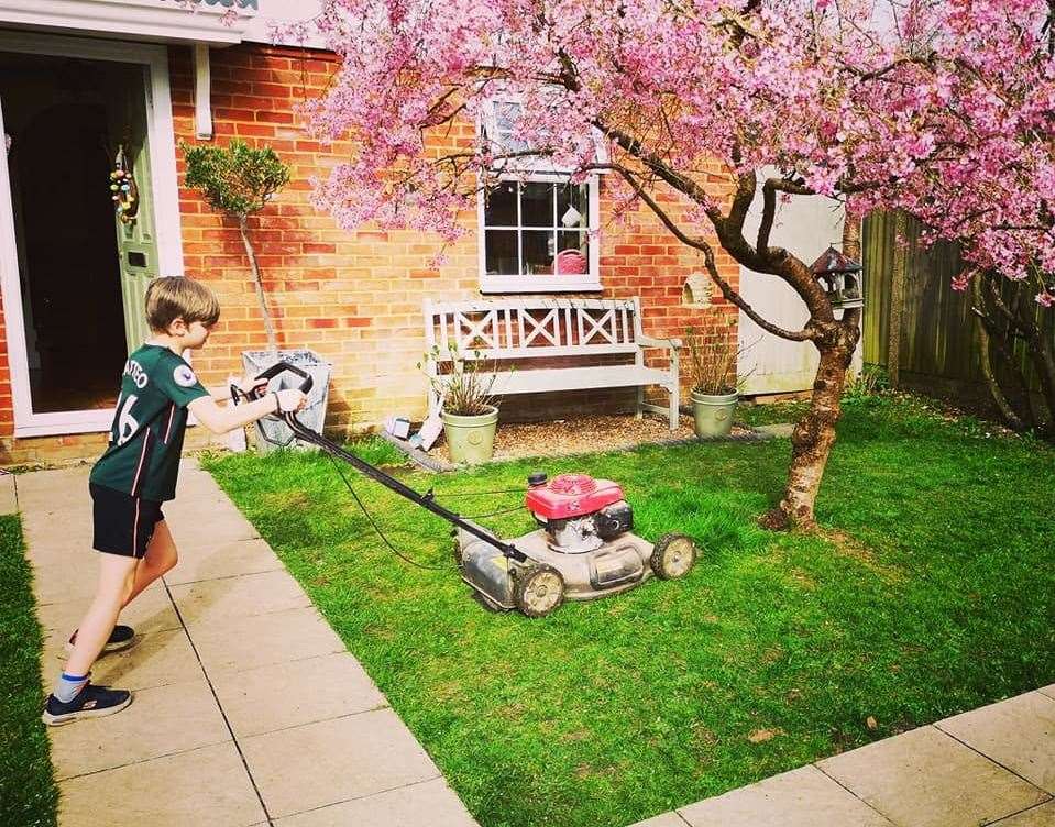 Matteo Robinson, 9, has launched his own grass-cutting business. Picture: Anthony Robinson