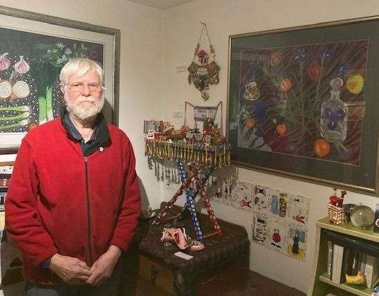 Richard Cooper at home in Selling, surrounded by some of his late wife's artwork