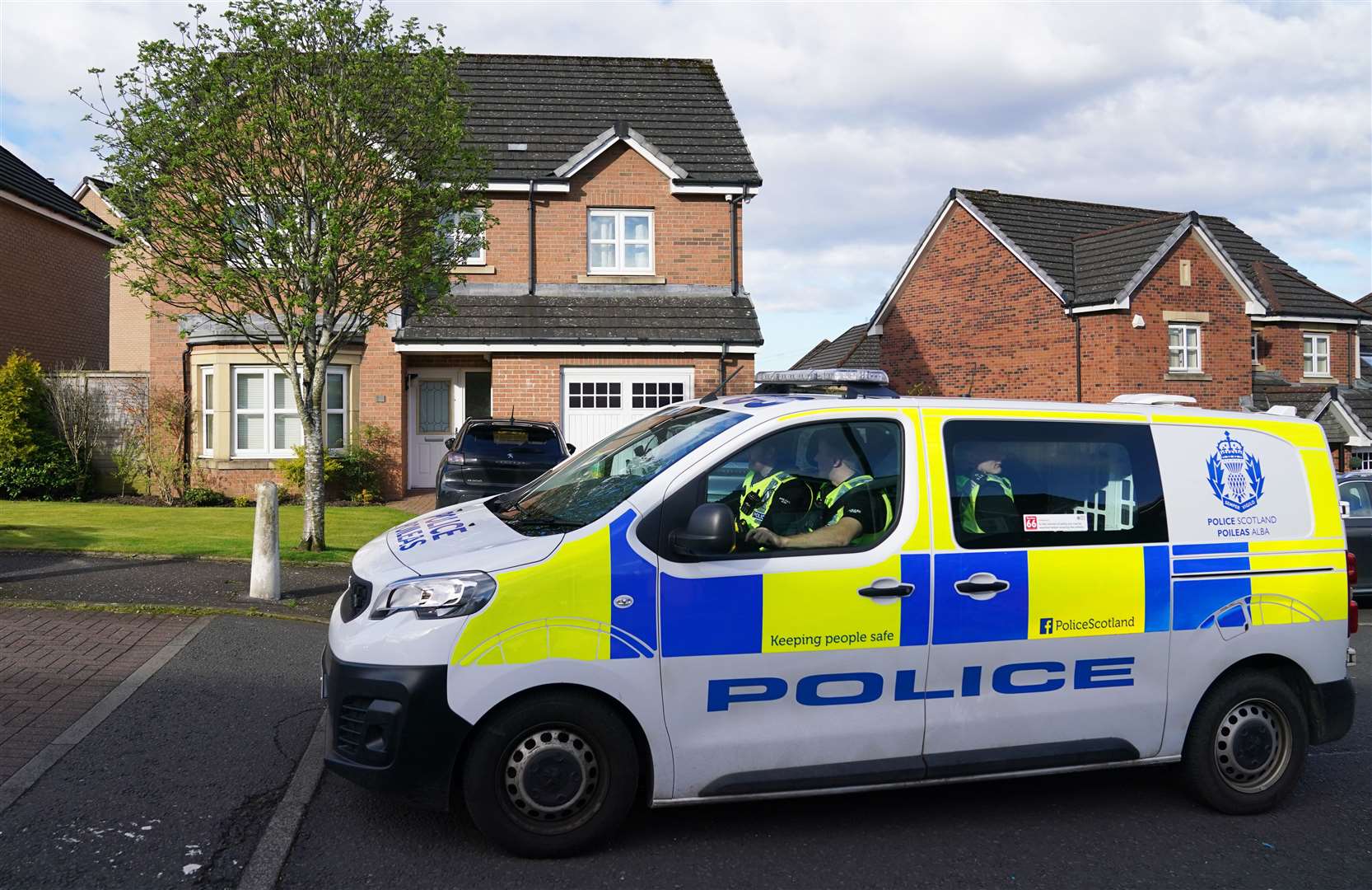 A police patrol passes the home of Nicola Sturgeon in Uddingston after her husband Peter Murrell was charged in connection with embezzlement of SNP funds (Andrew Milligan/PA)