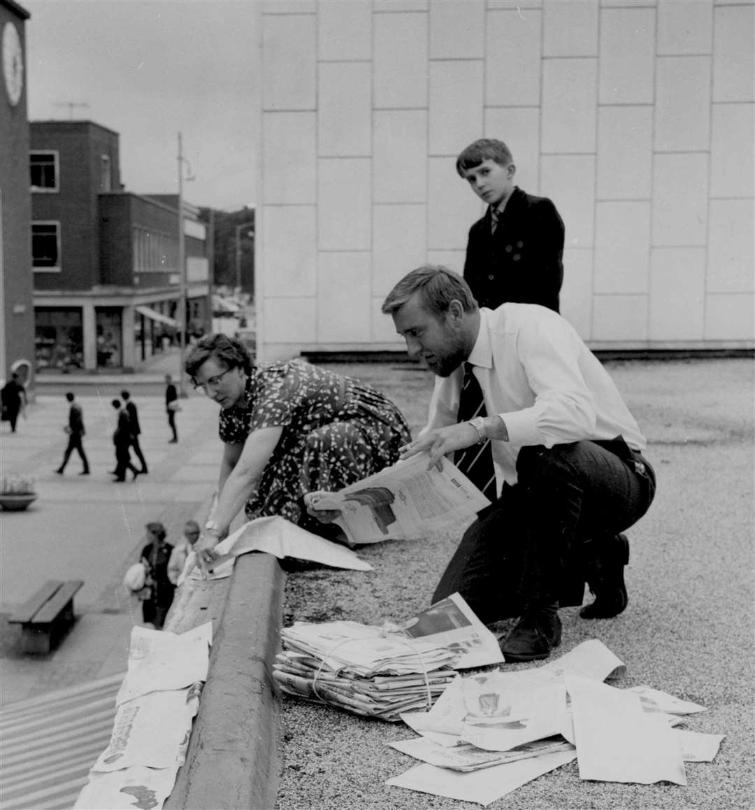 Anti-pigeon measures in Longmarket, Canterbury, went wrong in 1964. A substance smeared along the edges of roofs was intended to put the pigeons off - but birds became gummed up and fell to the ground. Three pigeons and 17 starlings had to be destroyed. Here, Longmarket Traders Association chairman Andrew Price helps cover the substance with newspaper