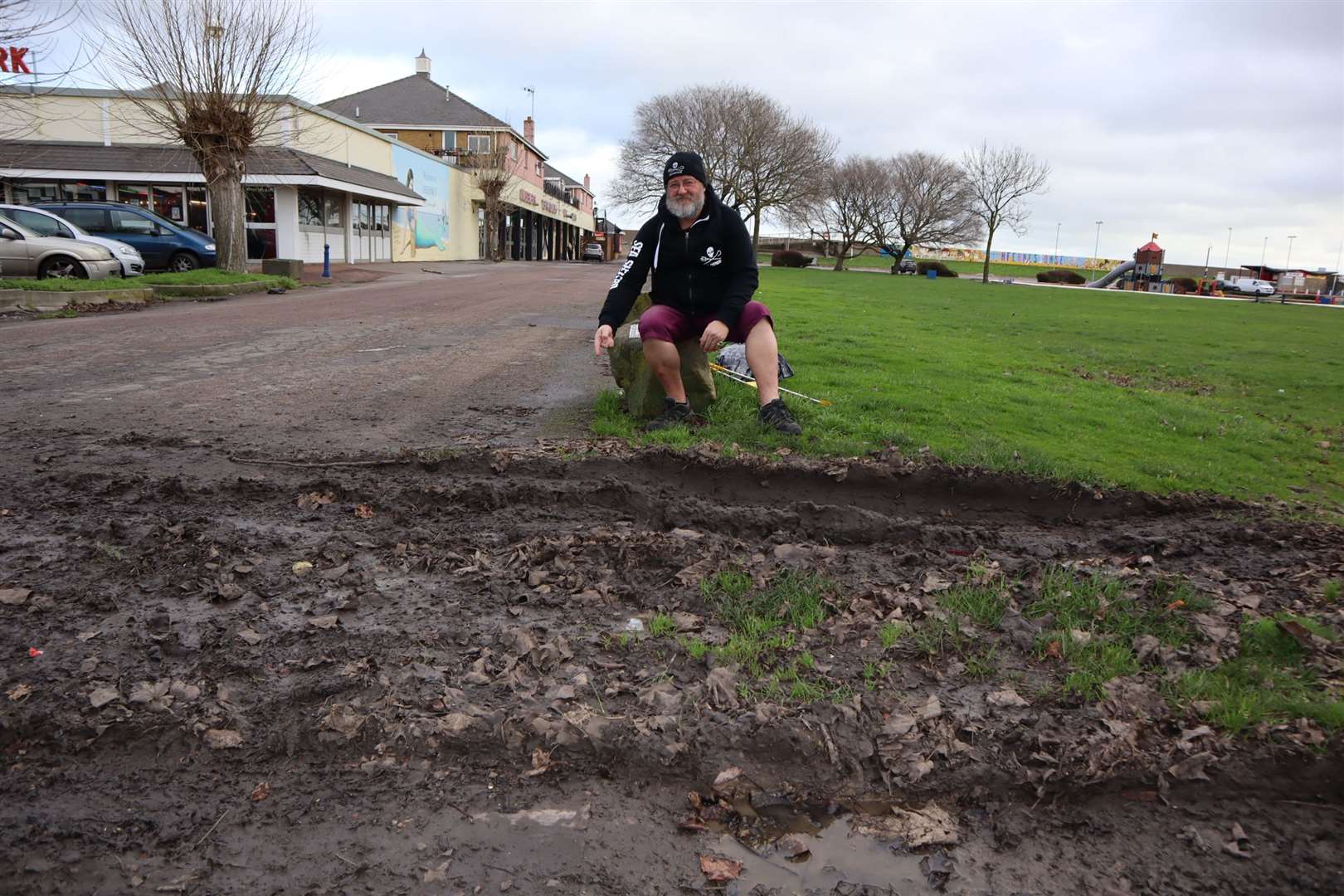 Phil Crowder shows where vehicles have churned up mud and damaged the Sheppey millennium time-line in Sheerness