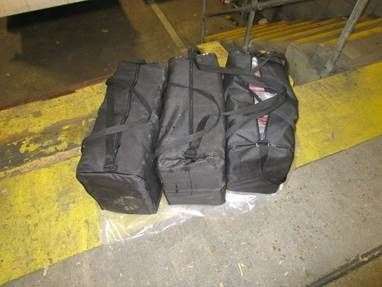 Officers who searched the vehicle they found blocks of cocaine stuffed in holdall bags Picture: NCA