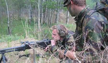 KM-fm reporter Ed Cook gets first-hand experience of a machine gun