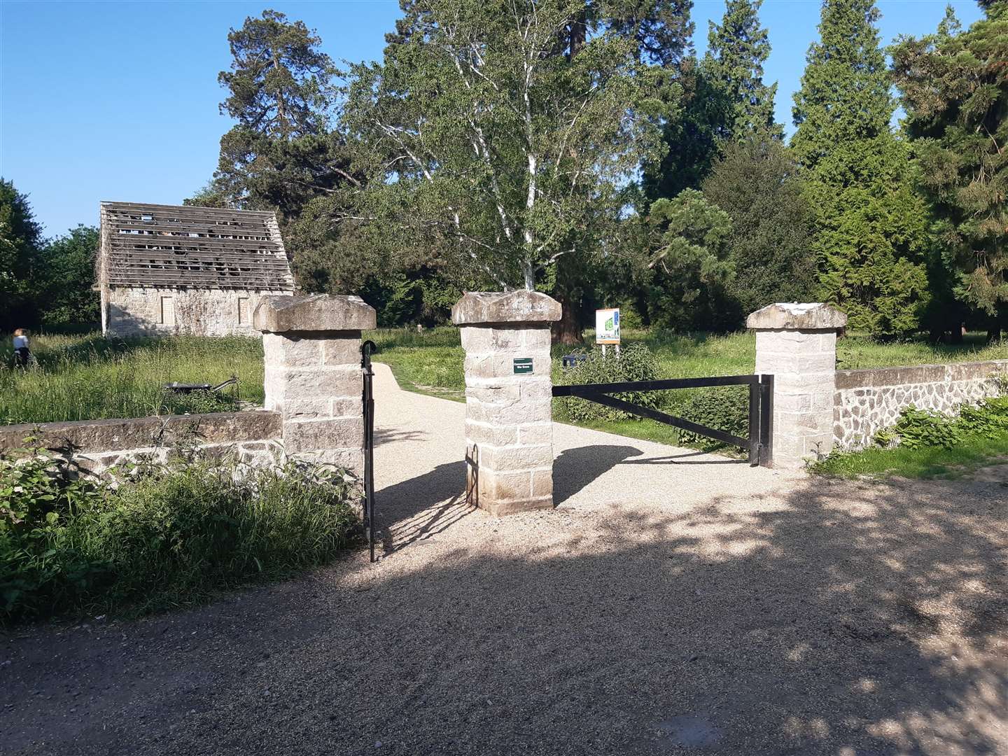 The main entrance to Oakwood Cemetery with the derelict chapel visible in the background