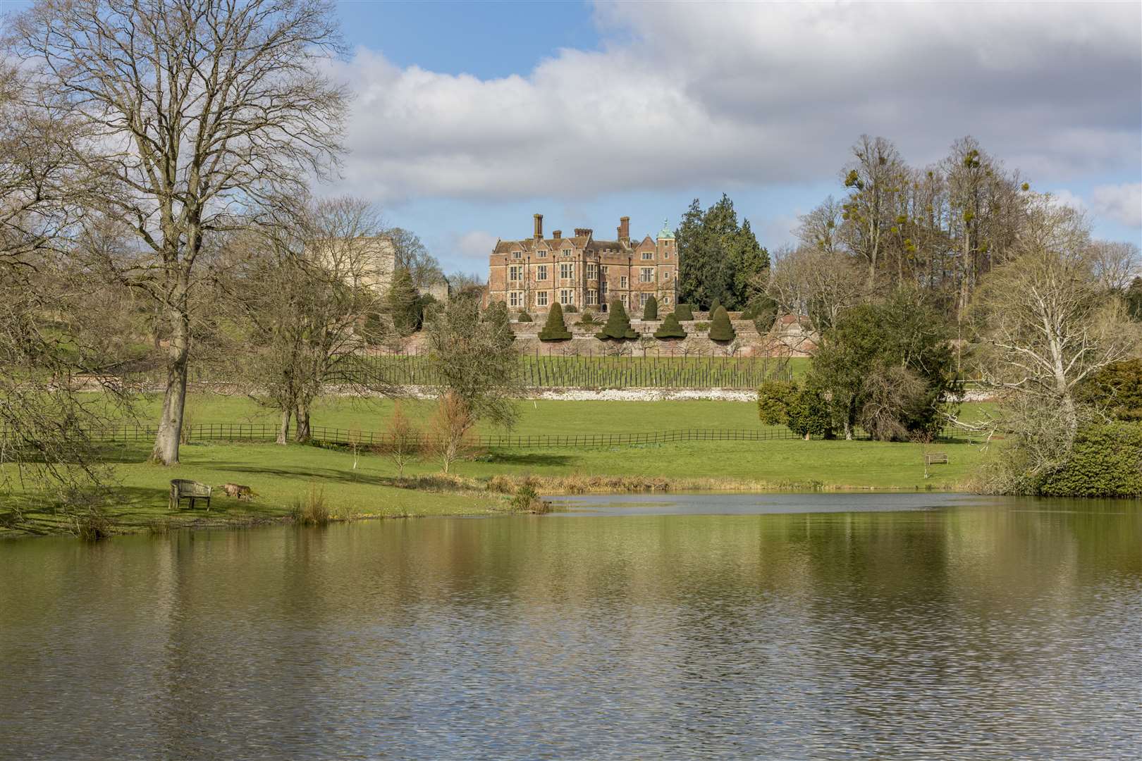 The grounds feature a three-acre lake, along with a boathouse. Picture: Knight Frank