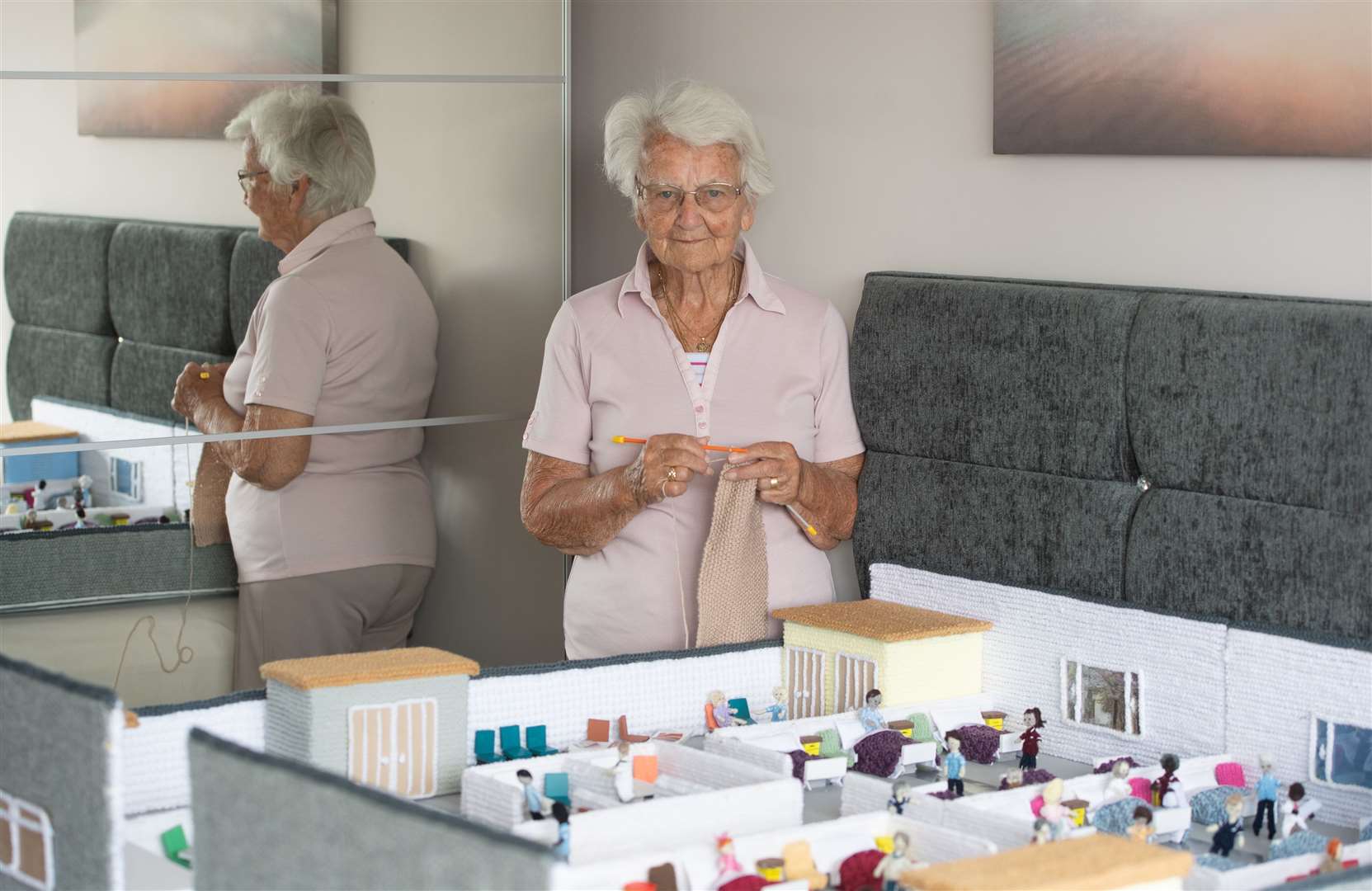 Margaret Seaman with her model of the Knittingale Hospital, which she has created to raise funds for the NHS (Joe Giddens/ PA)
