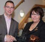 Award winner Paul Bailes of Cohesion Design Services receives his prize from Carol Baron from University of Kent