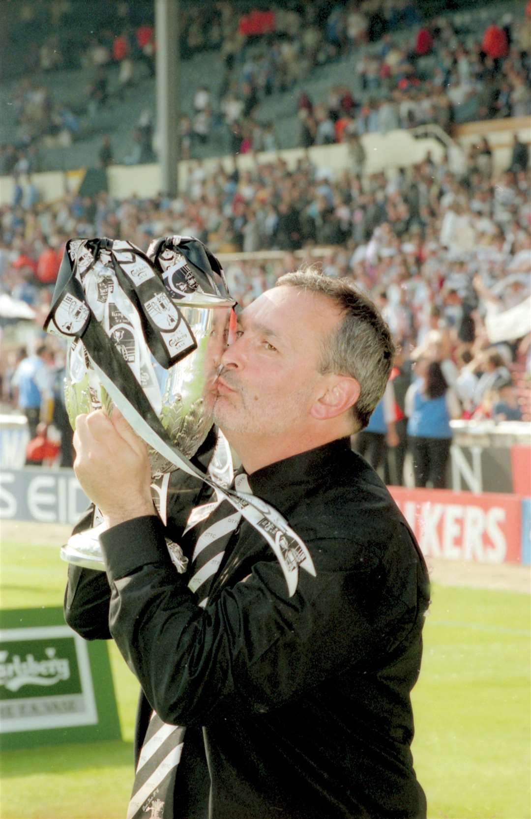 Mr Sampson kissing the FA Vase after their win in 2000. Picture: Paul Dennis